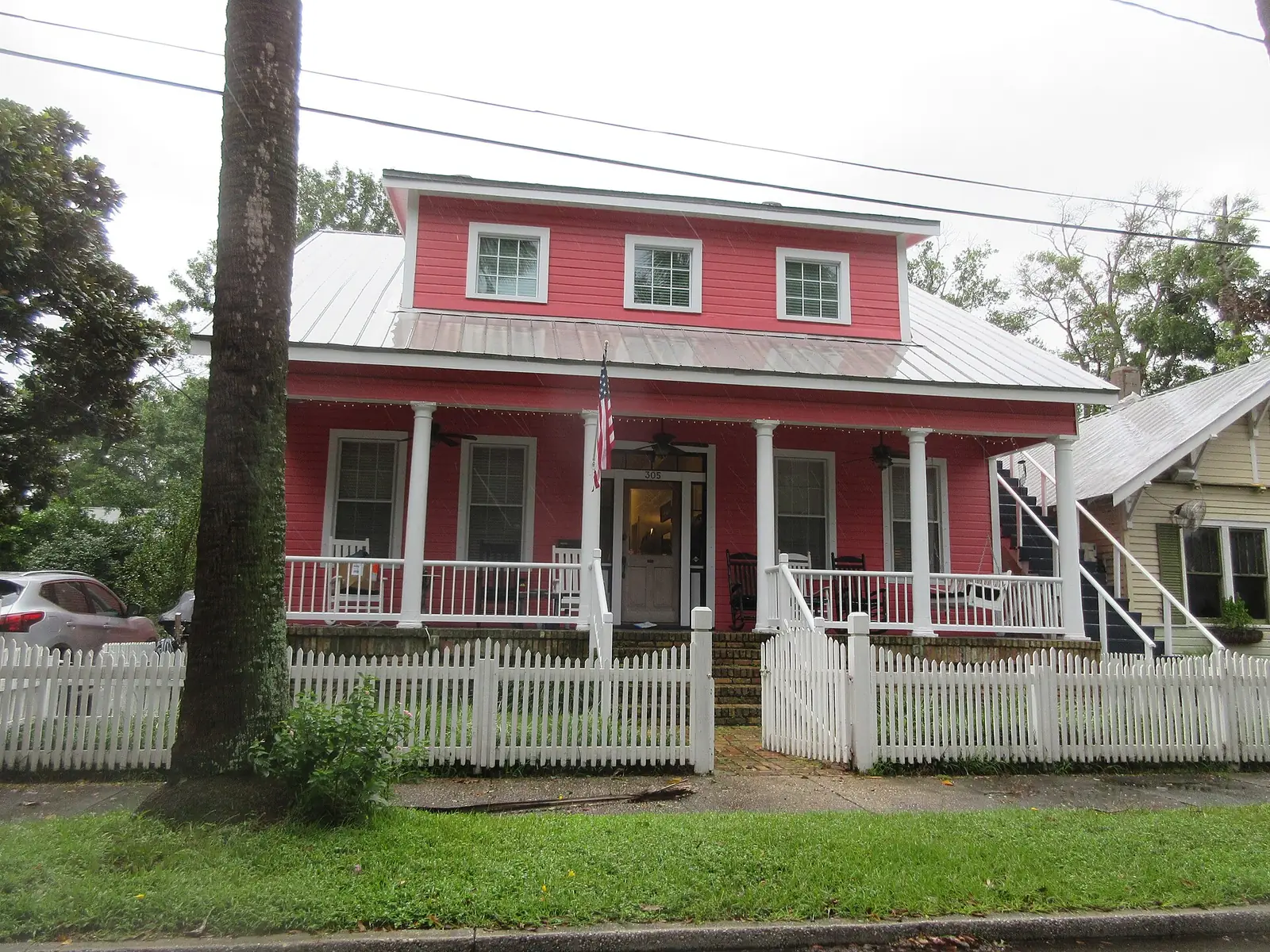 Houses with white picket fences on Adams Street in Pensacola.
