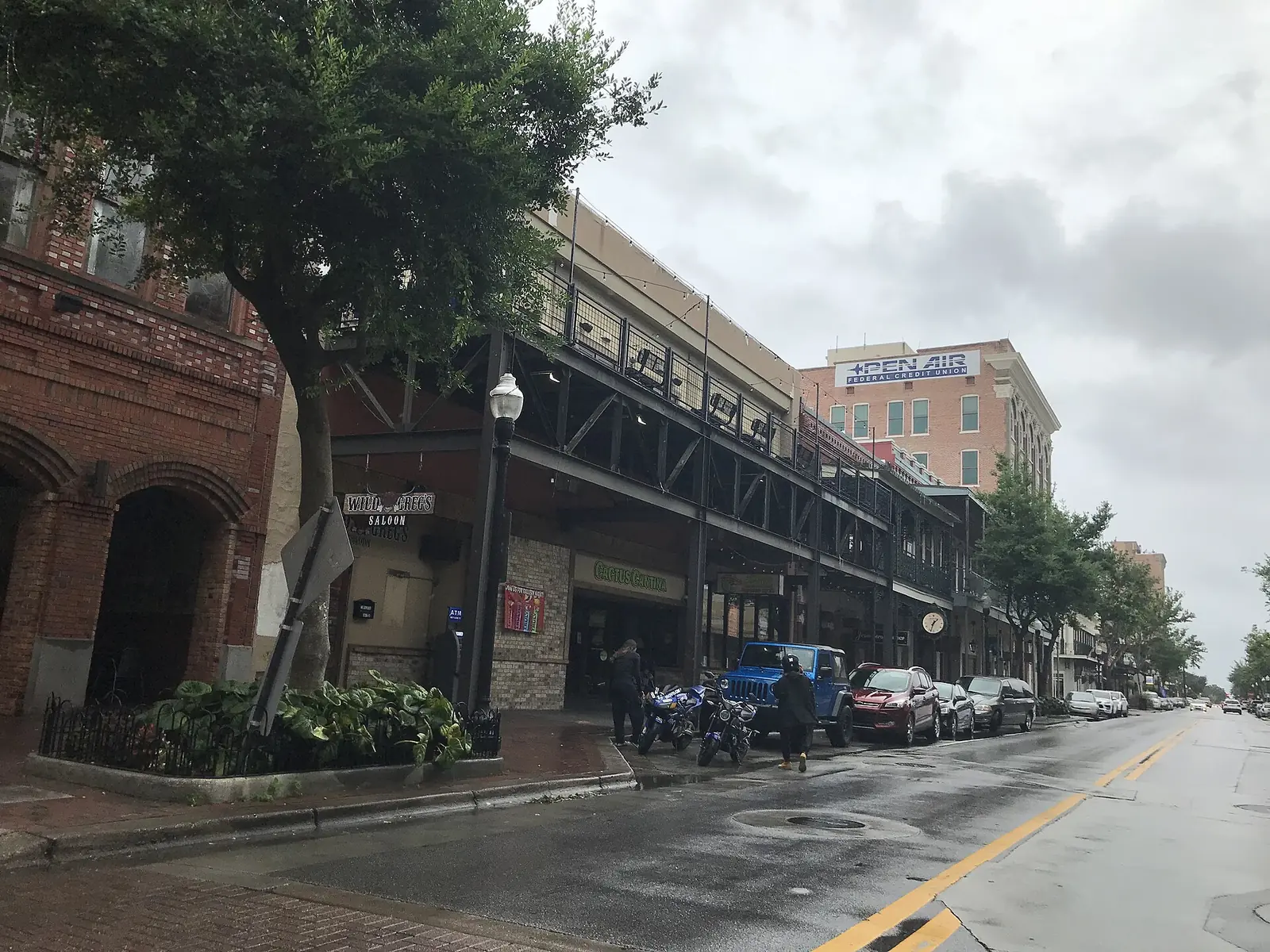 Iron-balconied storefronts and restaurants along South Palafox Street in downtown Pensacola.
